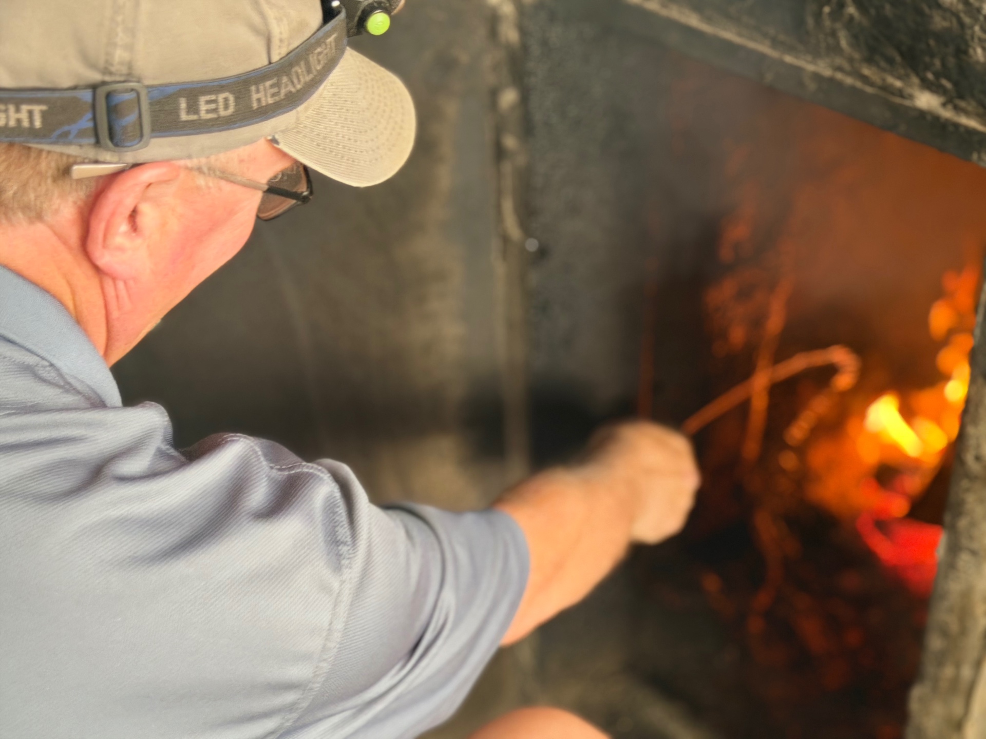 Stoking the fire by headlamp